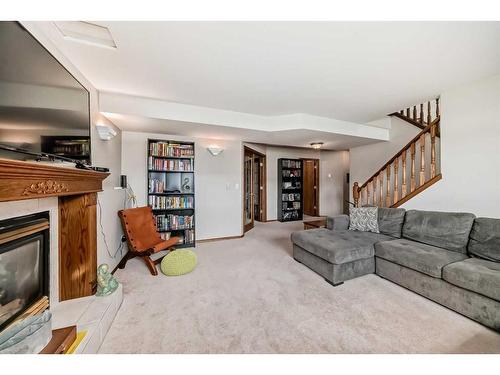 5909 61 Avenue, Ponoka, AB - Indoor Photo Showing Living Room With Fireplace