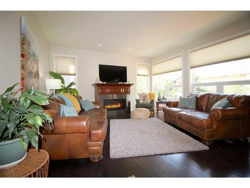 69 Grove Close, Red Deer, AB - Indoor Photo Showing Living Room With Fireplace