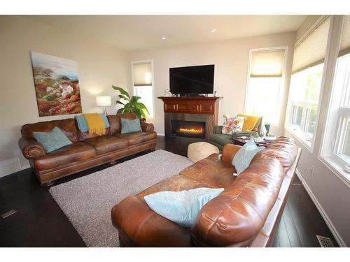 69 Grove Close, Red Deer, AB - Indoor Photo Showing Living Room With Fireplace