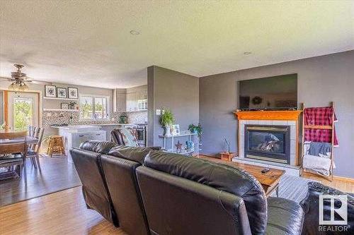 4703 52 Avenue, Warburg, AB - Indoor Photo Showing Living Room With Fireplace