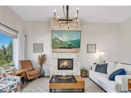 36 Meadow Close, Lacombe, AB - Indoor Photo Showing Living Room With Fireplace