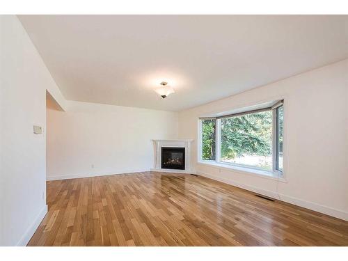 3749 43A Avenue, Red Deer, AB - Indoor Photo Showing Living Room With Fireplace