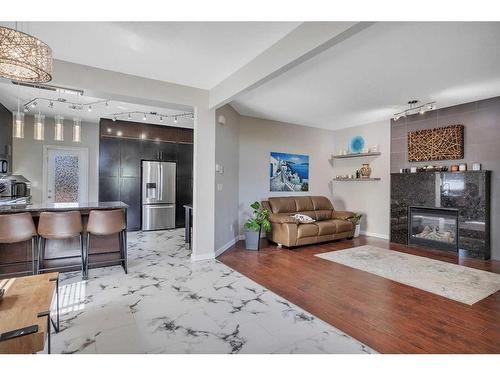 66 Crossley Street, Red Deer, AB - Indoor Photo Showing Living Room With Fireplace