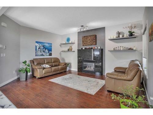 66 Crossley Street, Red Deer, AB - Indoor Photo Showing Living Room With Fireplace