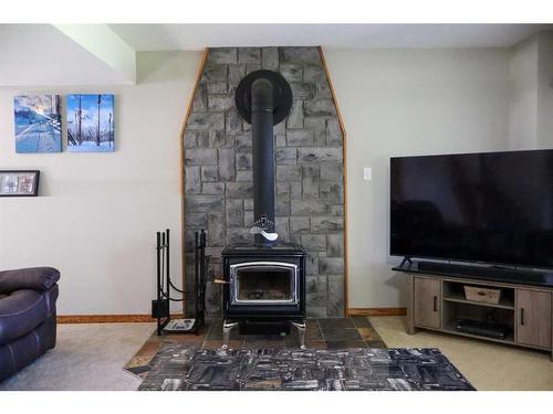 81073 Old Highway 11A, Rural Clearwater County, AB - Indoor Photo Showing Living Room With Fireplace