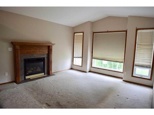 4204 55 Avenue Crescent, Innisfail, AB - Indoor Photo Showing Living Room With Fireplace