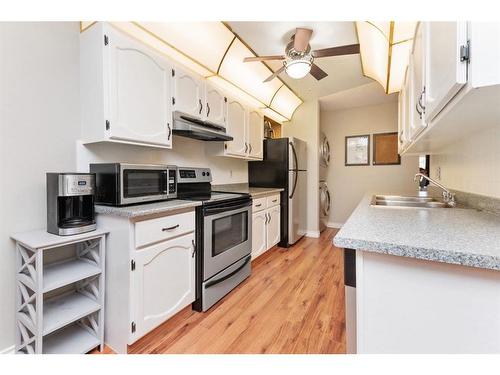 214-54 Bell Street, Red Deer, AB - Indoor Photo Showing Kitchen With Double Sink