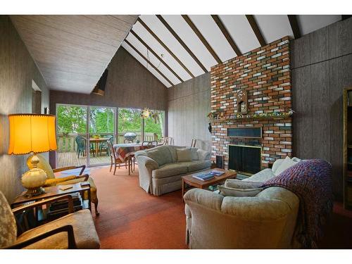 5 Shady Drive, Rochon Sands, AB - Indoor Photo Showing Living Room With Fireplace