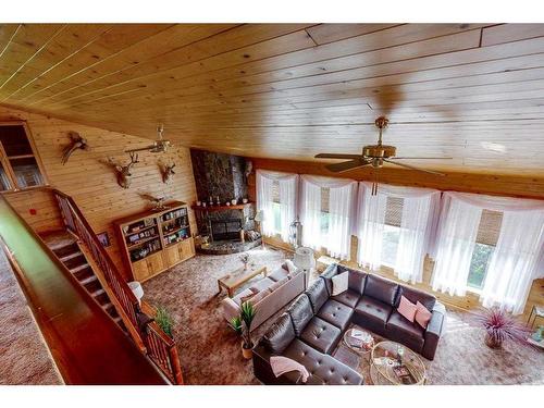 231-28302 Highway 12A, Rural Lacombe County, AB - Indoor Photo Showing Living Room With Fireplace