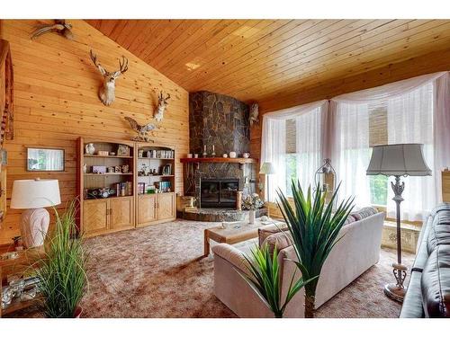 231-28302 Highway 12A, Rural Lacombe County, AB - Indoor Photo Showing Living Room With Fireplace