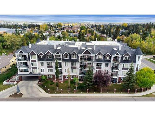 204-4707 50 Street, Sylvan Lake, AB - Outdoor With Body Of Water With Facade