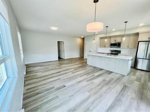 104-40 Carrington Plaza Nw, Calgary, AB - Indoor Photo Showing Kitchen With Stainless Steel Kitchen