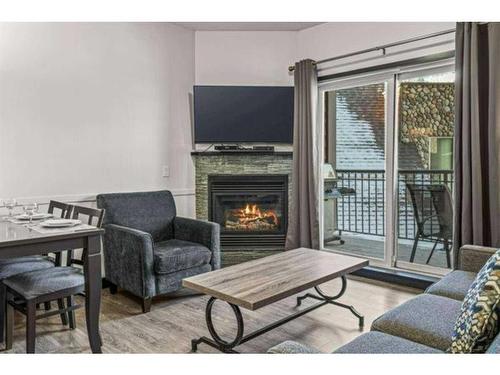 241-901 Mountain Street, Canmore, AB - Indoor Photo Showing Living Room With Fireplace