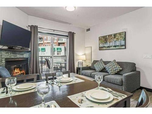 241-901 Mountain Street, Canmore, AB - Indoor Photo Showing Living Room With Fireplace