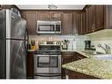 241-901 Mountain Street, Canmore, AB  - Indoor Photo Showing Kitchen With Double Sink With Upgraded Kitchen 