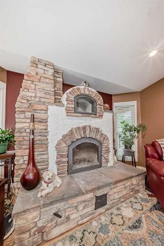 430068 Range Road 252, Rural Ponoka County, AB - Indoor Photo Showing Living Room With Fireplace