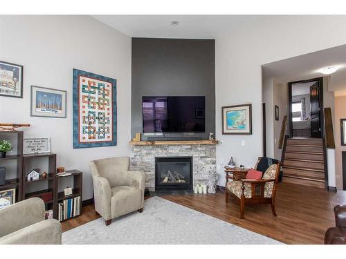 10 Iron Wolf Close, Lacombe, AB - Indoor Photo Showing Living Room With Fireplace