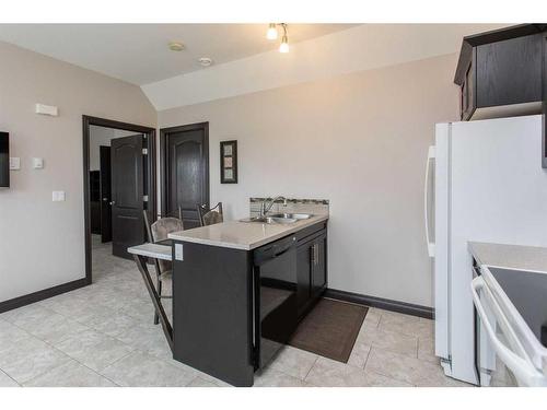 10 Iron Wolf Close, Lacombe, AB - Indoor Photo Showing Kitchen With Double Sink