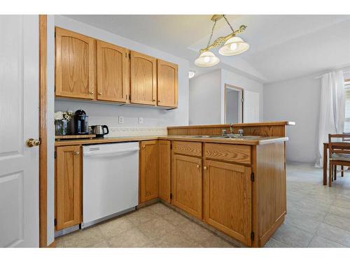 58 Old Boomer Road, Sylvan Lake, AB - Indoor Photo Showing Kitchen With Double Sink
