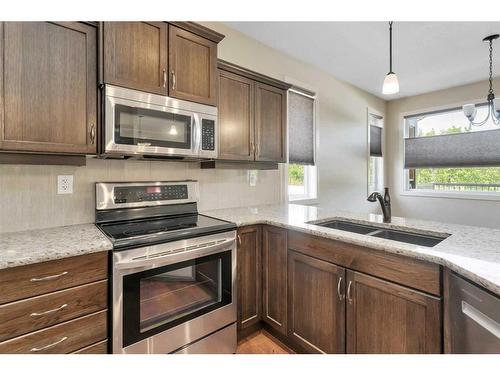 83 Cedar Square, Blackfalds, AB - Indoor Photo Showing Kitchen With Double Sink