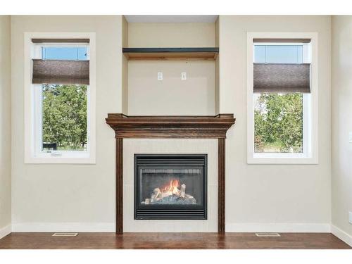 83 Cedar Square, Blackfalds, AB - Indoor Photo Showing Other Room With Fireplace