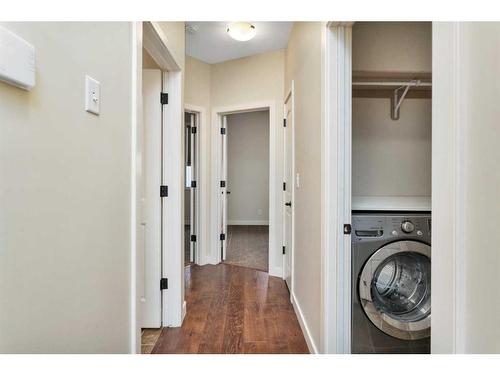 83 Cedar Square, Blackfalds, AB - Indoor Photo Showing Laundry Room