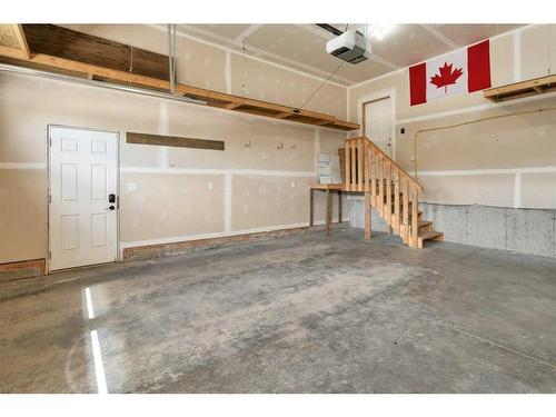 83 Cedar Square, Blackfalds, AB - Indoor Photo Showing Garage