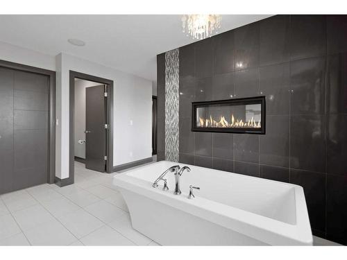 5 Larratt Close, Red Deer, AB - Indoor Photo Showing Bathroom With Fireplace