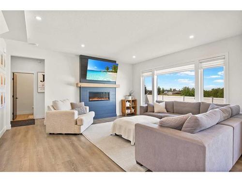 8 Cameron Court, Lacombe, AB - Indoor Photo Showing Living Room With Fireplace