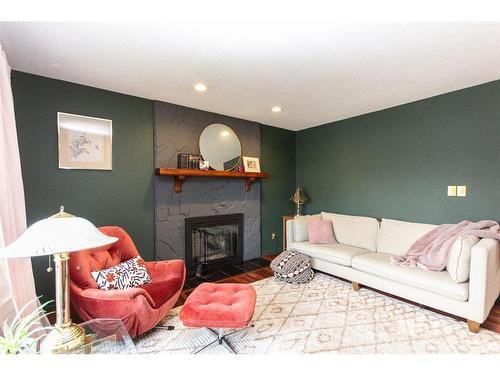 119 Mclevin Crescent, Red Deer, AB - Indoor Photo Showing Living Room With Fireplace