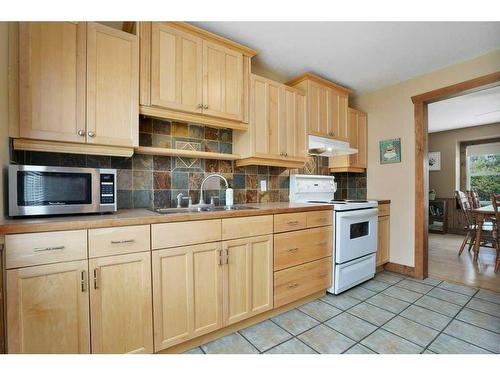 26 Sunnyside Drive, Rural Ponoka County, AB - Indoor Photo Showing Kitchen With Double Sink