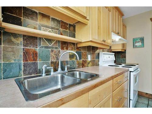 26 Sunnyside Drive, Rural Ponoka County, AB - Indoor Photo Showing Kitchen With Double Sink