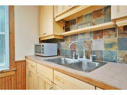 26 Sunnyside Drive, Rural Ponoka County, AB - Indoor Photo Showing Kitchen With Double Sink