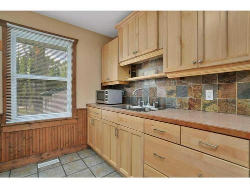 26 Sunnyside Drive, Rural Ponoka County, AB - Indoor Photo Showing Kitchen With Double Sink