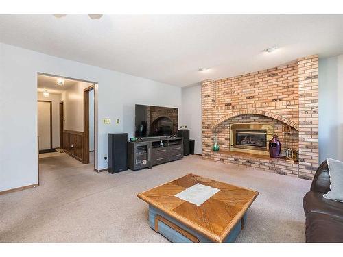 45 Gilbert Crescent, Red Deer, AB - Indoor Photo Showing Living Room With Fireplace