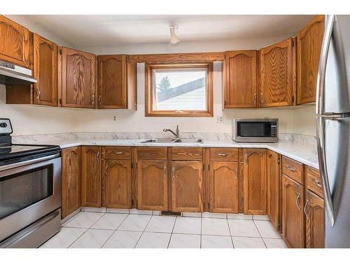 45 Gilbert Crescent, Red Deer, AB - Indoor Photo Showing Kitchen With Double Sink