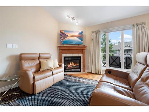 55-173 Austin Drive, Red Deer, AB - Indoor Photo Showing Living Room With Fireplace