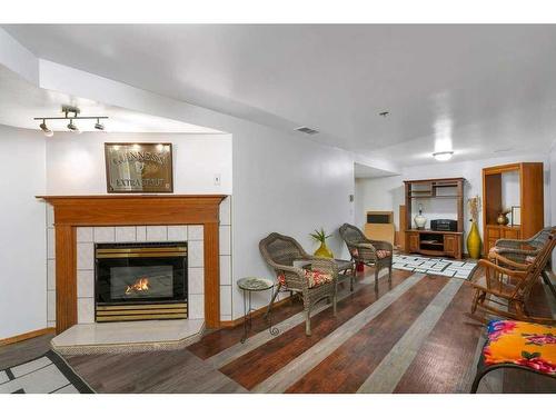 36009 Highway 2A South, Rural Red Deer County, AB - Indoor Photo Showing Living Room With Fireplace
