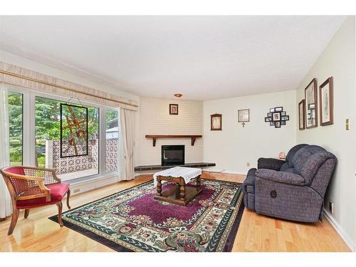 24 Anderson Close, Red Deer, AB - Indoor Photo Showing Living Room With Fireplace