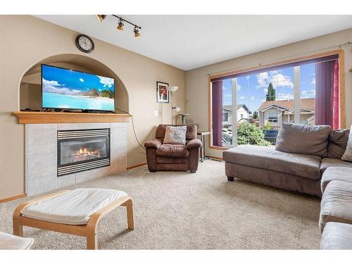 135 Keith Close, Red Deer, AB - Indoor Photo Showing Living Room With Fireplace
