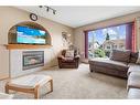 135 Keith Close, Red Deer, AB  - Indoor Photo Showing Living Room With Fireplace 