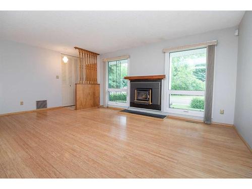3 Macleod Close, Red Deer, AB - Indoor Photo Showing Living Room With Fireplace