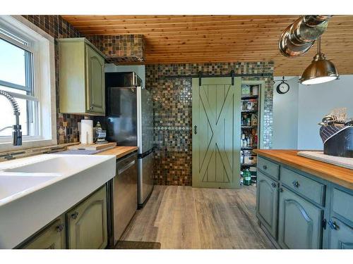 24027 Highway 595, Rural Red Deer County, AB - Indoor Photo Showing Kitchen With Double Sink