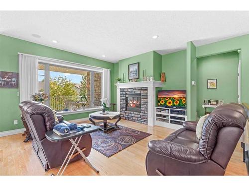 107 Wyndham Crescent, Red Deer, AB - Indoor Photo Showing Living Room With Fireplace