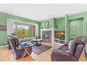 107 Wyndham Crescent, Red Deer, AB  - Indoor Photo Showing Living Room With Fireplace 