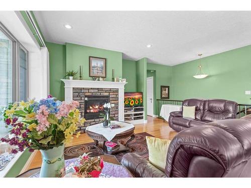 107 Wyndham Crescent, Red Deer, AB - Indoor Photo Showing Living Room With Fireplace