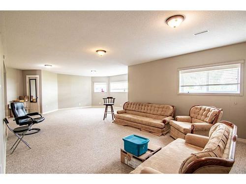 30 Country, Clive, AB - Indoor Photo Showing Living Room