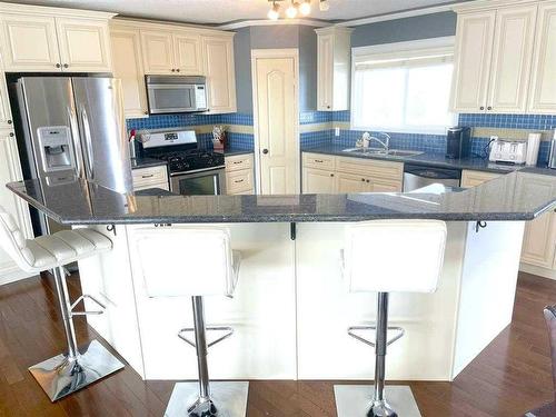 30 Country, Clive, AB - Indoor Photo Showing Kitchen With Double Sink