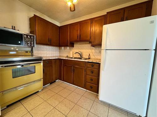 5902 55 Avenue, Red Deer, AB - Indoor Photo Showing Kitchen With Double Sink