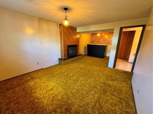 5902 55 Avenue, Red Deer, AB - Indoor Photo Showing Other Room With Fireplace